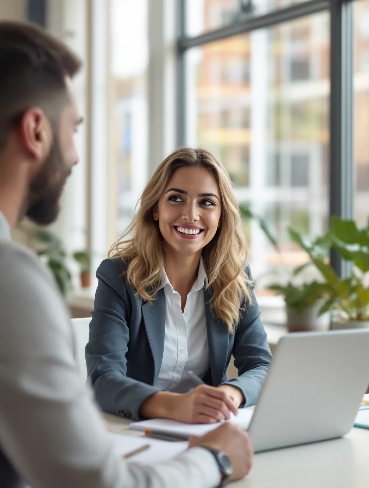 A financial adviser meeting a small-business owner across a desk, one of the small businesses Pay Monthly Websites UK builds websites for